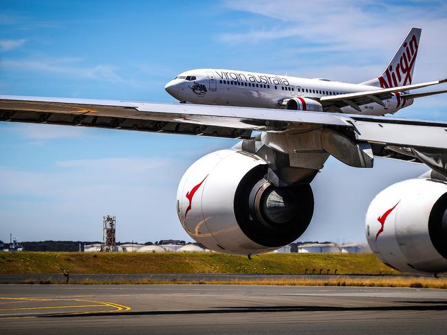 Qantas and Virgin Australia planes at Kingsford Smith International airport on November 15, 2019 in Sydney, Australia.