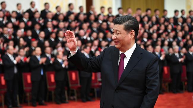 Chinese President Xi Jinping meets with role models in China's poverty alleviation fight at the Great Hall of the People in Beijing.