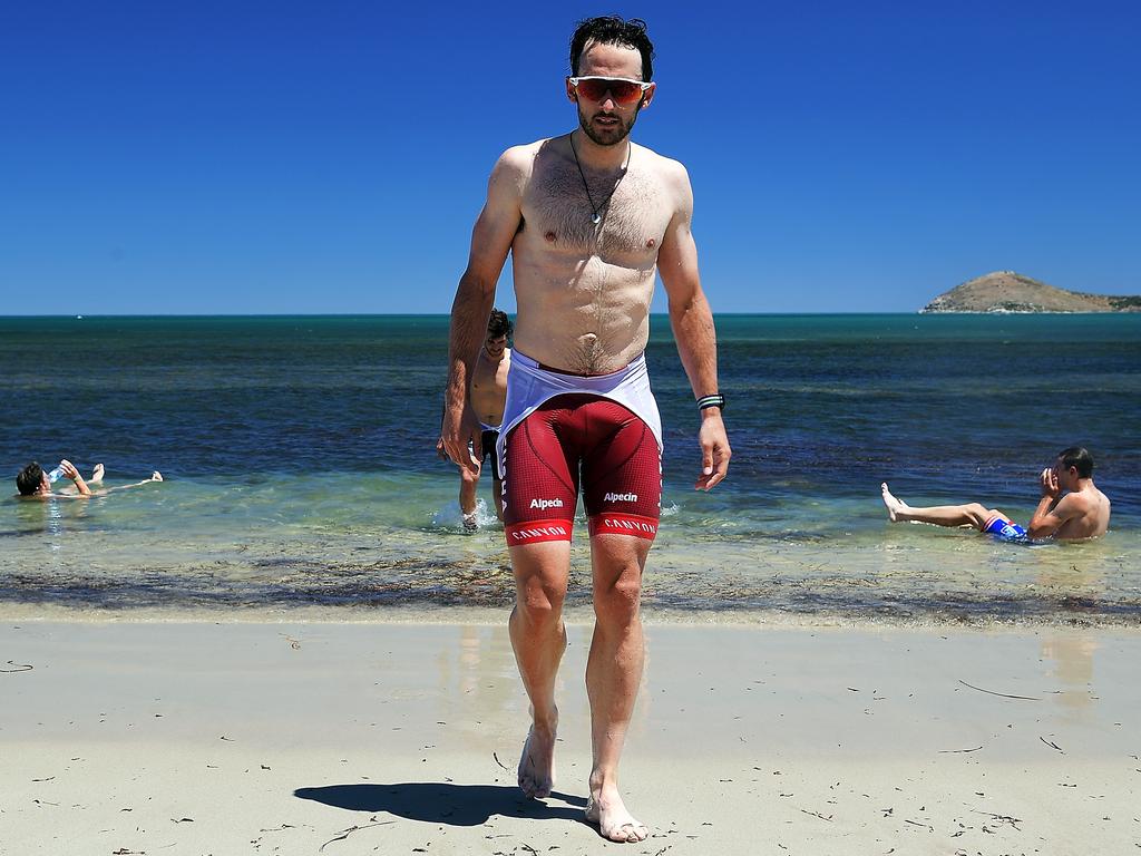 Nathan Haas cools off at the beach at Victor Harbor after stage three of the Tour Down Under. Picture: Daniel Kalisz/Getty Images