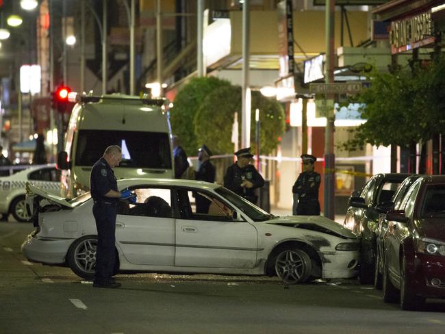 Police with the car involved in the chase. Picture: Scott Oates