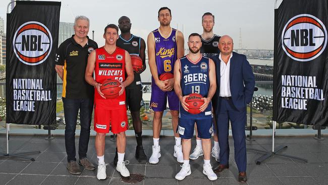 (L-R) Andrew Gaze, coach of the Sydney Kings; Damian Martin of the Perth Wildcats; Majok Majok of the New Zealand Breakers; Andrew Bogut of the Sydney Kings; Adam Doyle of the Adelaide 36ers; David Barlow of Melbourne United and NBL Chief Executive Officer, Larry Kestelman pose during pose at the announcement of the plan for five NBL teams will travel to the U.S. to participate in the NBA preseason. Picture: Getty Images