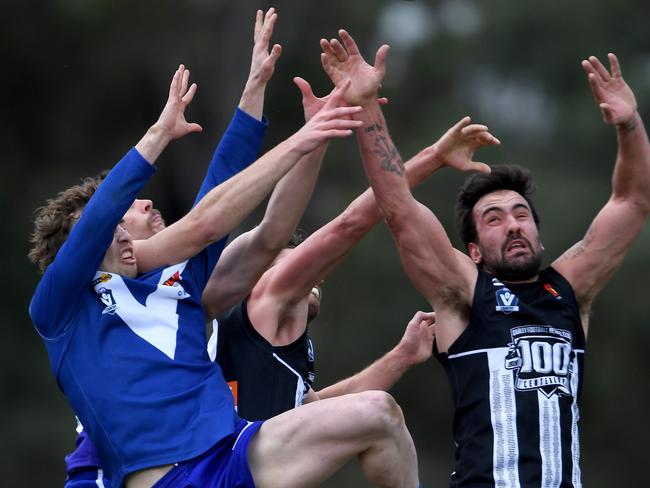 Sunbury and Darley players fly for the ball. Picture: Andy Brownbill