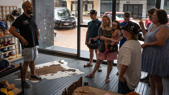 Brett "Knuckles" Hanly with Vincent and Luke Gordon who drove all the way up from Tassie to buy a hat from the store in Mary St, Gympie. Picture: Christine Schindler