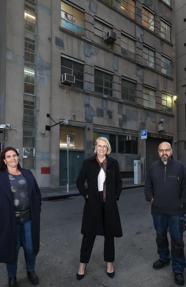 Lord Mayor Sally Capp (centre) with former rough sleepers Luis Herrera and Lisa Townsend in front of the building that will be transformed into housing for homeless. Picture: Ian Currie