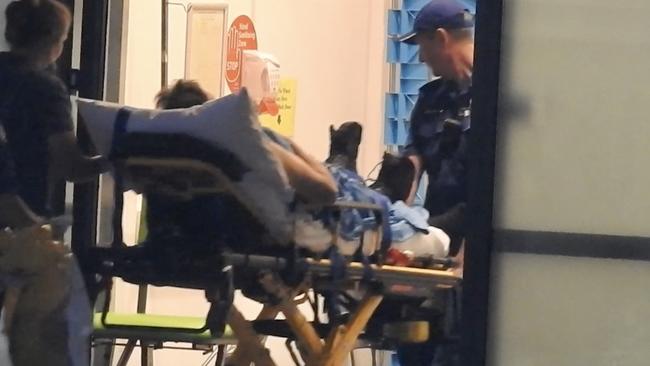 An officer from the Mid North Coast Correctional Centre arrives at Port Macquarie Base Hospital. Picture: Nathan Edwards