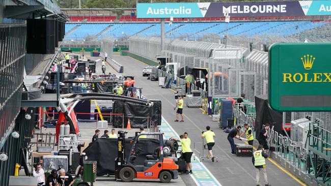 Workers swoop in to dismantle and pack up at Albert Park. Picture: AAP Image/Michael Dodge