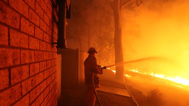 Firefighters protect properties at Colo Heights. Picture: Rohan Kelly