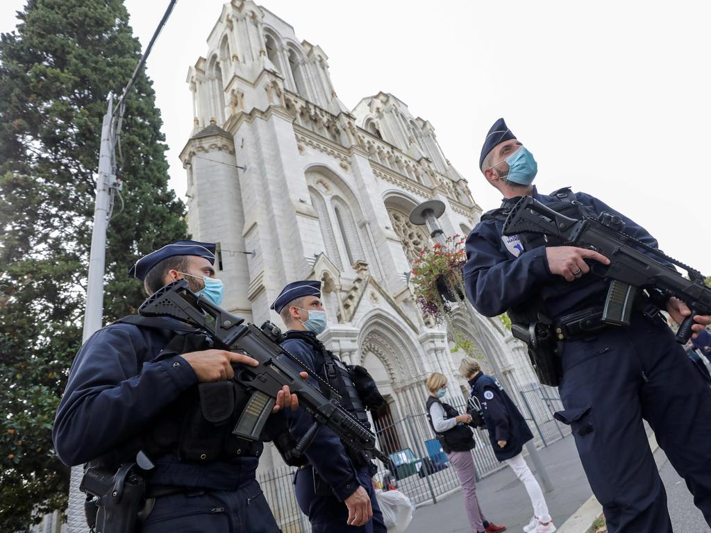 Police officers stand guard by the Notre-Dame de l’Assomption Basilica in Nice. Picture: Eric Gaillard/AFP