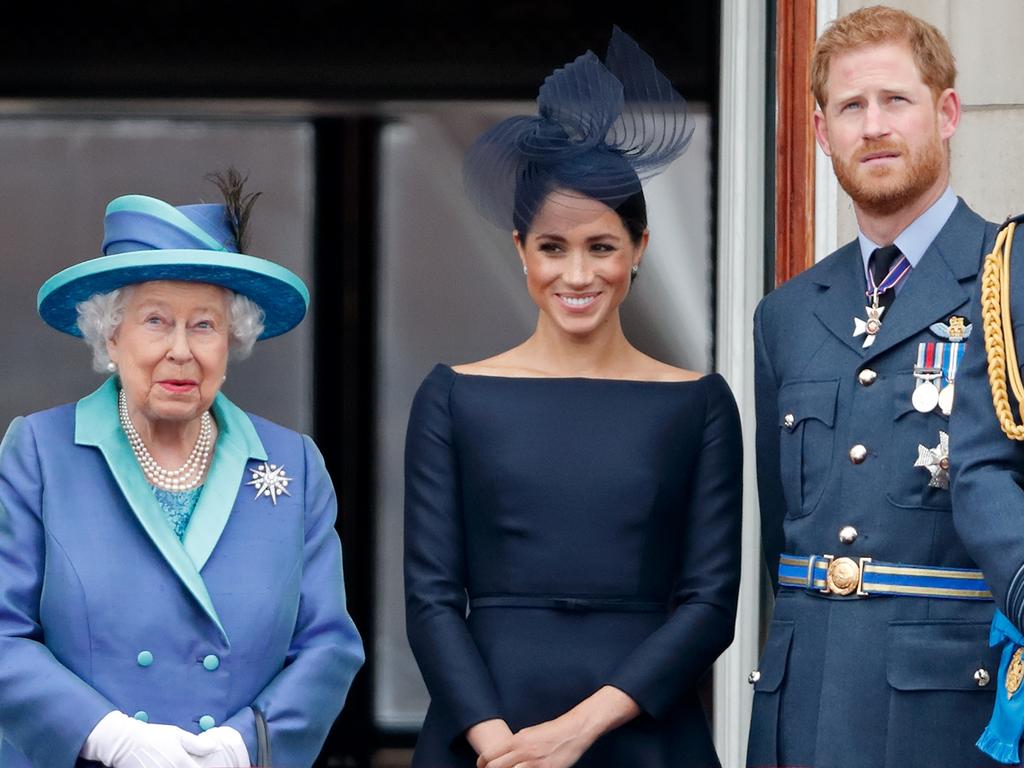 Queen Elizabeth II, Meghan, Duchess of Sussex, Prince Harry, Duke of Sussex on the balcony of Buckingham Palace. Picture: Max Mumby/Indigo/Getty Images