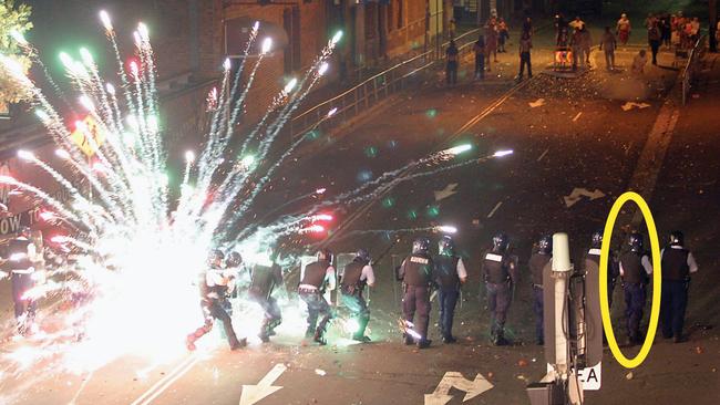 Dan Wilson (circled) in the firing line with police colleagues during the Redfern riot in 2004.