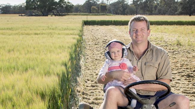 CROPS: Barley Banquet at RupanyupPICTURED: Barley Banquet at Rupanyup Ash Teasdale and 8 month old daughter June, mowing at the location of the banquet.Picture: Zoe Phillips