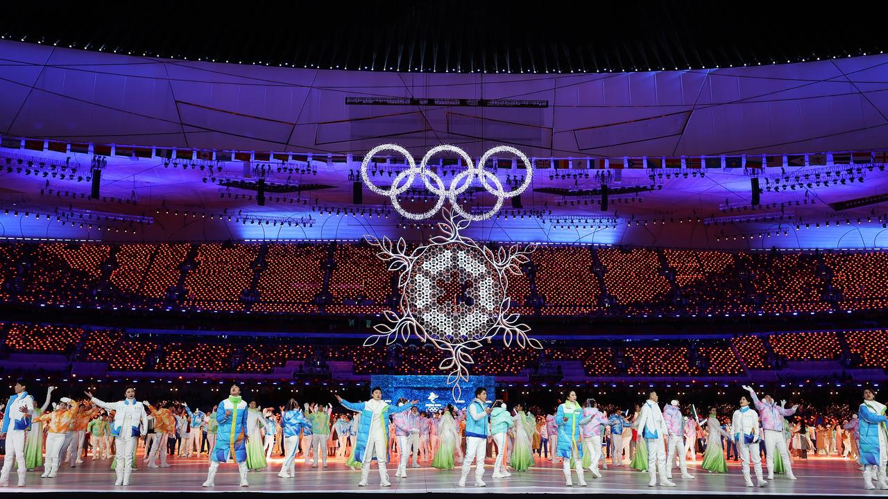 BEThe Olympic Cauldron and rings are seen as performers dance during the Beijing 2022 Winter Olympics Closing Ceremony. Picture: Getty Images