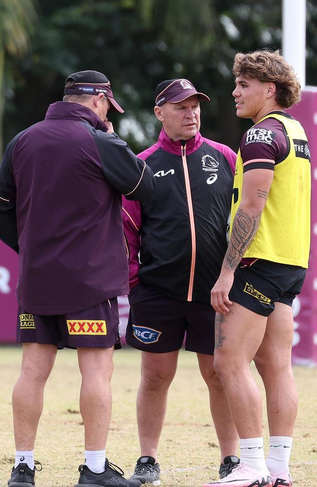 Kevin Walters (L) and Allan Langer (C) talk shop with injured superstar Reece Walsh. Picture: Liam Kidston