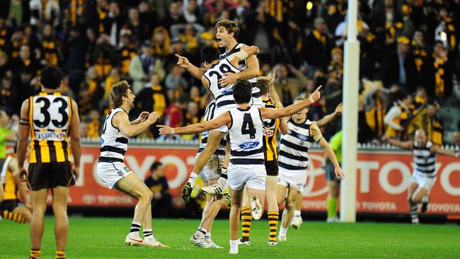 Tom Hawkins celebrates sinking the Hawks with a goal after the siren in 2012.