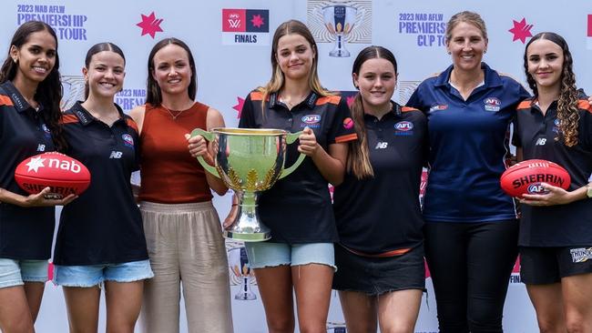 Daisy Pearce is joined by AFLNT Talent Manager, Shannon Millar and footballers from the Northern Territory Talent Girls Academy at TIO Stadium today to welcome the 2023 NAB AFLW Premiership Cup Tour to Darwin. Photo: Jono Laird