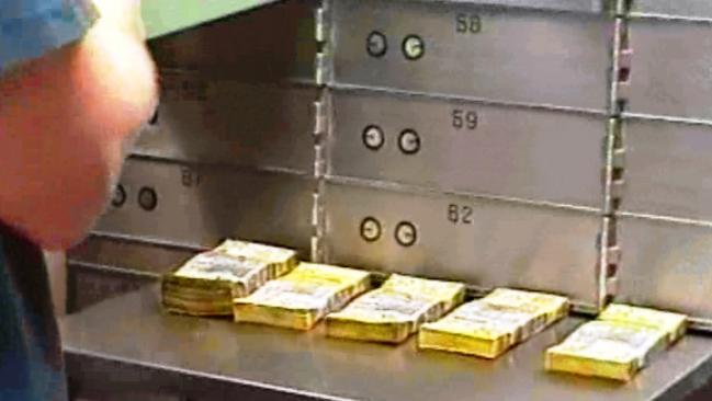 A police evidence photo from March 2003 shows large amounts of cash in a CBA safe deposit box.  Picture: Supplied