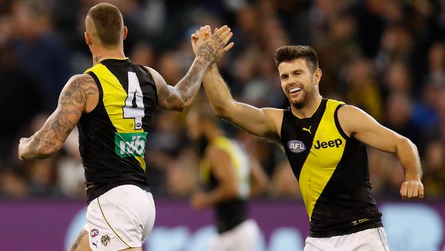 Dustin Martin and Trent Cotchin celebrate a goal.