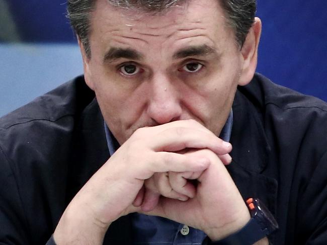 Outgoing Finance Minister Yanis Varoufakis (L) speaks next to newly appointed Greek Finance Minister Euclid Tsakalotos (R) during a handover ceremony at the Finance Ministry in Athens on July 6, 2015. Greeks declared in a referendum that they "deserve better" and "cannot accept a non-viable solution" to the country's debt crisis, new Finance Minister Euclid Tsakalotos said upon taking office. A 55-year-old leftist economist who had been a pointman in Greece's bailout talks since April, Tsakalotos replaced the flamboyant Yanis Varoufakis hours after the latter resigned on Monday, ostensibly to facilitate the negotiations. AFP PHOTO / ANGELOS TZORTZINIS