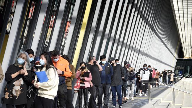 Long queues at the Melbourne Convention and Exhibition Centre vaccination centre on Wednesday morning. Picture: Andrew Henshaw