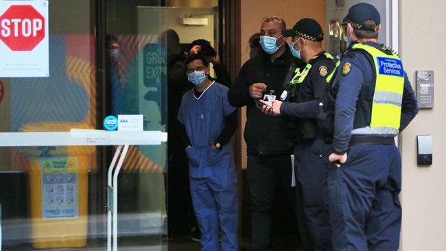 Police and staff at the Brady Hotel in Melbourne. Picture: Aaron Francis