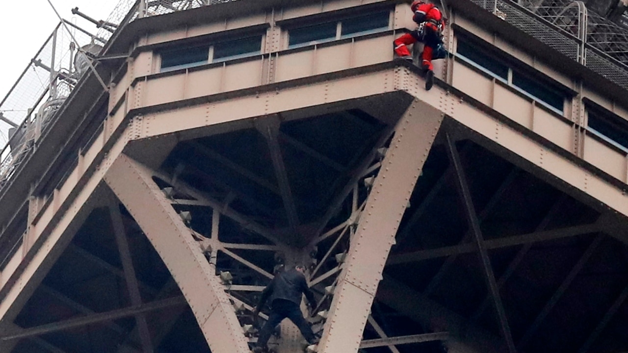 Man Climbs Eiffel Tower Clings To Side For Seven Hours The Courier Mail