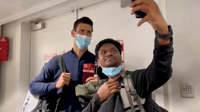 Novak Djokovic poses for a selfie after landing at Dubai Airport after the Australian Federal Court upheld a government decision to cancel his visa to play in the Australian Open in January. Picture: Reuters/Loren Elliott