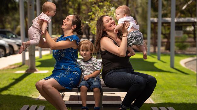 Maddie Hillyer with children Imogen, 10 months, and Archer, 2, and Nikki Hamilton with son Felix, 8 months, had to leave Roxby Downs before and during birth due to a lack of medical resources. Picture: Brad Fleet