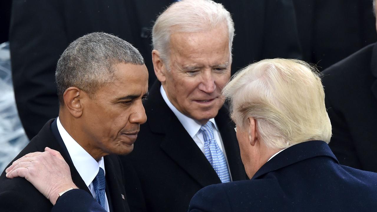 President Donald Trump speaks with former President Barack Obama and former Vice President Joe Biden during his inauguration ceremony on January 20, 2017. Picture: Paul J. RICHARDS / AFP.