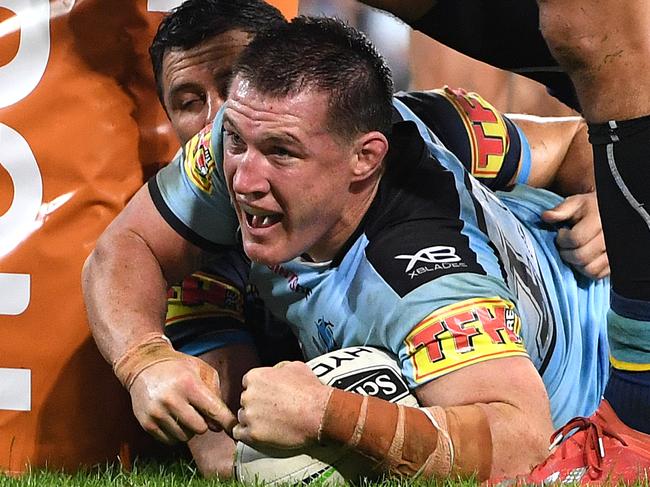 Paul Gallen of the Sharks scores a try on full time during the Round 9 NRL match between the Gold Coast Titans and the Cronulla Sharks at Suncorp Stadium in Brisbane, Thursday, May 9, 2019.  (AAP Image/Dave Hunt) NO ARCHIVING, EDITORIAL USE ONLY