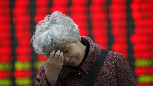 An investor reacts at a Chinese stock exchange corporation.