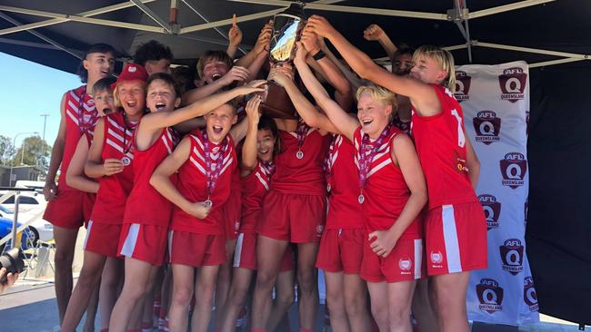 Palm Beach Currumbin Junior Men celebrate after winning their grand final. Picture: Laura Pettigrew.