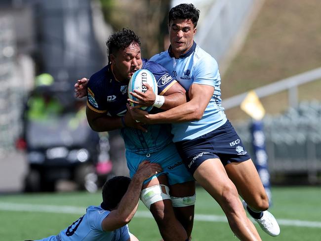 Moana Pasifika’s Semisi Tupou tackled by Lawson Creighton (L) and Joseph-Aukuso Suaalii of the Waratahs. Picture: Dave Rowland/Getty Images