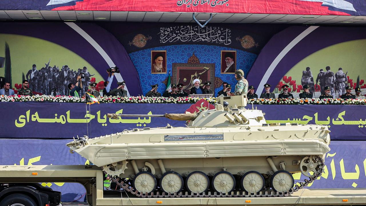 Members of the Iranian military were on show for President Hassan Rouhani (C) and other top military commanders on Sunday. Picture: AFP