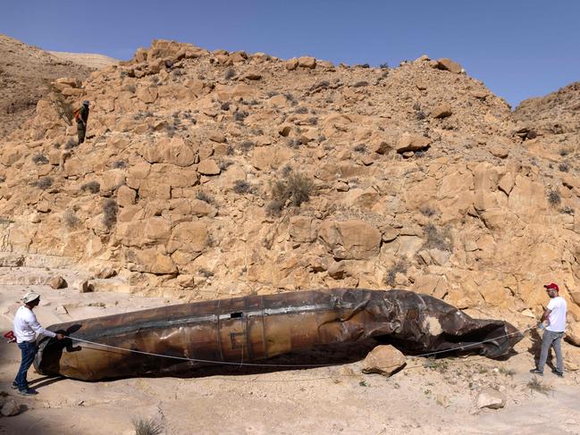 Israeli military personnel examine a segment of an Iranian ballistic missile found near Arad, following Iran’s direct attack on Israel with various missiles and drones in retaliation for an air strike in Damascus. Picture: Oren Ziv/AFP