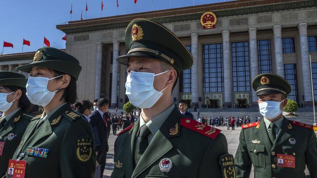 Military delegates outside the Great Hall of People. Picture: Kevin Frayer/Getty Images