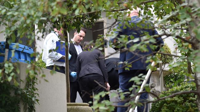 Missing persons squad detectives at Loughnane’s Brighton property. Picture : Nicki Connolly