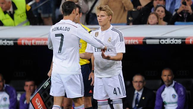 Martin Odegaard of Real Madrid comes on for Cristiano Ronaldo.