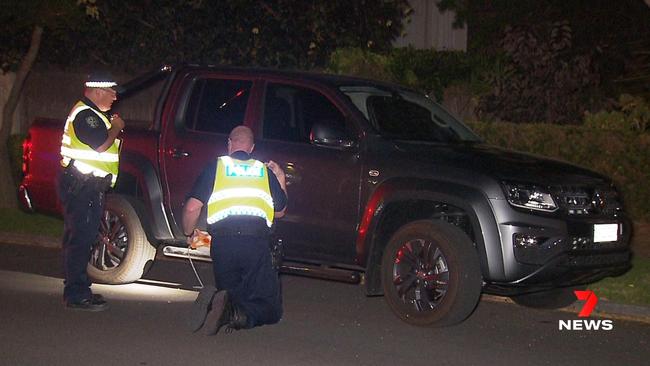 Investigators checking the car involved in the crash. Picture: 7NEWS