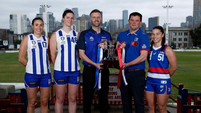 Jess Jones, Sarah King, Brett Gourley of the Kangaroos and Rhys Cahir, Dom Carbone of the Bulldogs pose during the 2024 rebel VFLW Grand Final media opportunity at ETU Stadium on July 15, 2024 in Melbourne, Australia. (Photo by Michael Willson/AFL Photos via Getty Images)