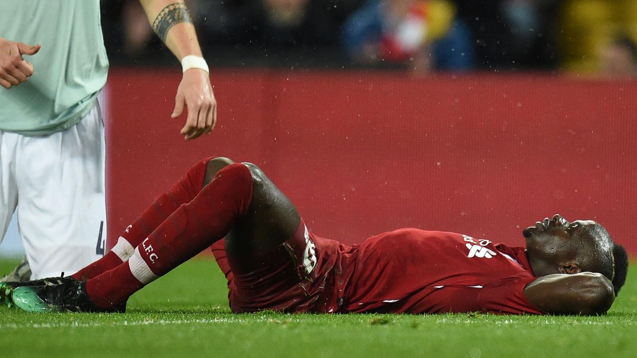 Liverpool's Senegalese striker Sadio Mane reacts after having his header saved
