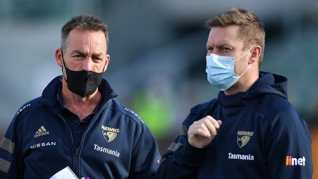 LAUNCESTON, AUSTRALIA – AUGUST 01: Alastair Clarkson Head Coach of the Hawks and Sam Mitchell, Head of Development of the Hawks are seen during the round 19 AFL match between Hawthorn Hawks and Brisbane Lions at University of Tasmania Stadium on August 01, 2021 in Launceston, Australia. (Photo by Steve Bell/AFL Photos/via Getty Images)