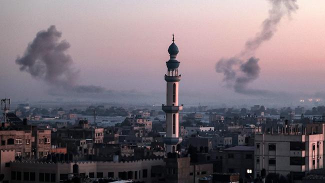 A picture taken from Rafah shows smoke billowing during Israeli bombardment over Khan Yunis in the southern Gaza Strip at sunrise on February 11, 2024, amid the ongoing conflict between Israel and the Palestinian Hamas militant group. Picture: AFP