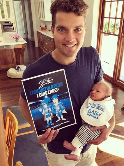 Alex Carey with his son Louis who has just clocked up two months.