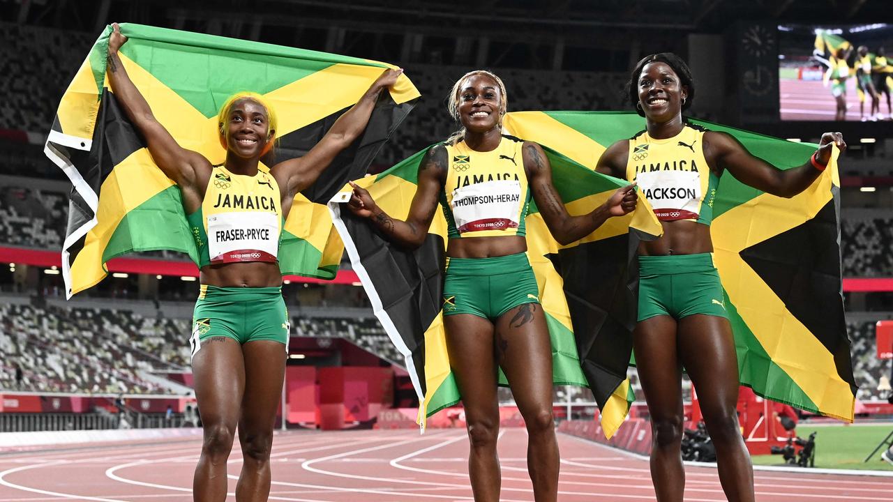 Winner Jamaica's Elaine Thompson-Herah (C) poses with second-placed Jamaica's Shelly-Ann Fraser-Pryce (L) and third-placed Jamaica's Shericka Jackson.