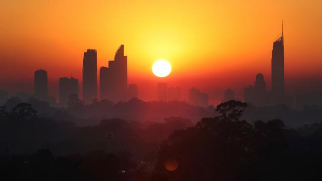 Highrises are blanketed in smoke. Picture: Glenn Hampson