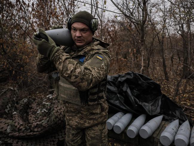 TOPSHOT - A Ukrainian serviceman of the 24th Mechanized Brigade carries a shell to fire a 2s5 152 mm self-propelled howitzer towards Russian positions at an undisclosed location near Chasiv Yar in Donetsk region on November 18, 2024, amid the Russian invasion of Ukraine. (Photo by Handout / 24th Mechanized Brigade of Ukrainian Armed Forces / AFP) / RESTRICTED TO EDITORIAL USE - MANDATORY CREDIT "AFP PHOTO / Press service of the 24th Mechanized Brigade of Ukrainian Armed Forces " - NO MARKETING NO ADVERTISING CAMPAIGNS - DISTRIBUTED AS A SERVICE TO CLIENTS