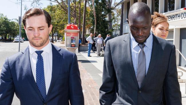 Western Sydney FC football player &amp; Socceroo Ruon Tongyik (R) leaves Penrith Courthouse with his lawyer Bobby Hill (L). Picture: Max Mason-Hubers