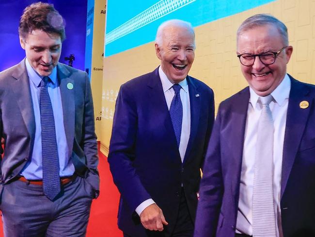 This handout picture released by the Peruvian news agency Andina shows US President Joe Biden (C), Canada's Prime Minster Justin Trudeau and Australian Prime Minister Anthony Albanese smiling during the APEC Summit at the Convention Centre in Lima, on November 15, 2024. (Photo by ANDRES VALLE / ANDINA / AFP) / RESTRICTED TO EDITORIAL USE - MANDATORY CREDIT "AFP PHOTO / ANDINA / ANDRES VALLE" - NO MARKETING - NO ADVERTISING CAMPAIGNS - DISTRIBUTED AS A SERVICE TO CLIENTS