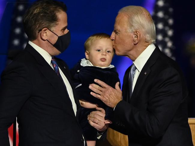 Joe Biden with his son, Hunter, and grandson after claiming victory in the US election. Picture: AFP