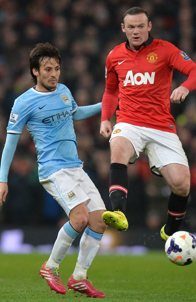 David Silva with Wayne Rooney.